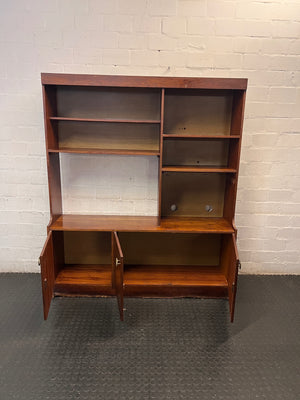 Vintage-Style Brown Wooden Wall Unit with Cabinets — Structural Damage and Wear to Base and Doors – side view