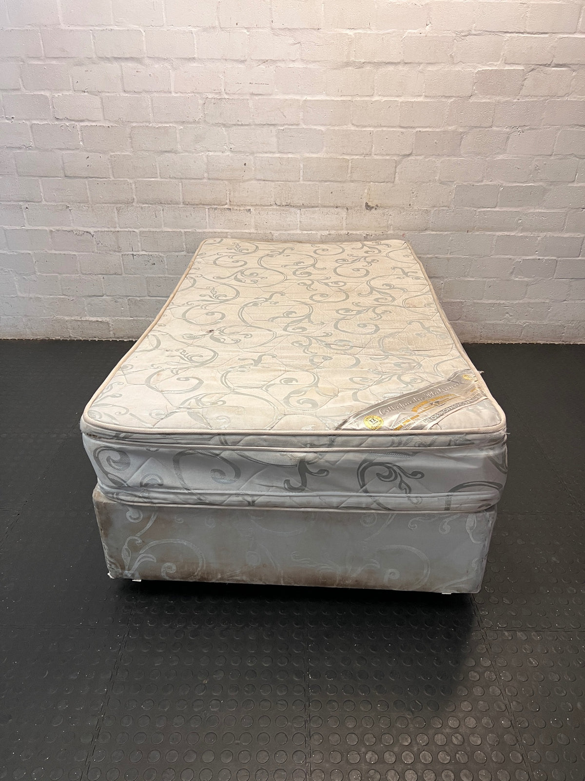Single Upholstered Base Set with Patterned Mattress — Well Used with Significant Staining – main front view