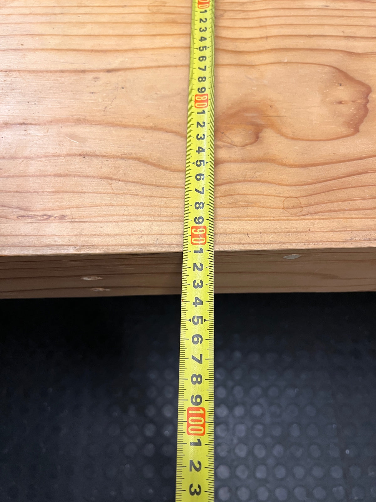 Rustic Oak-Tone Wooden Dining and Work Table — Unfinished Wood with Paint Splatter and Water Rings – depth measurement