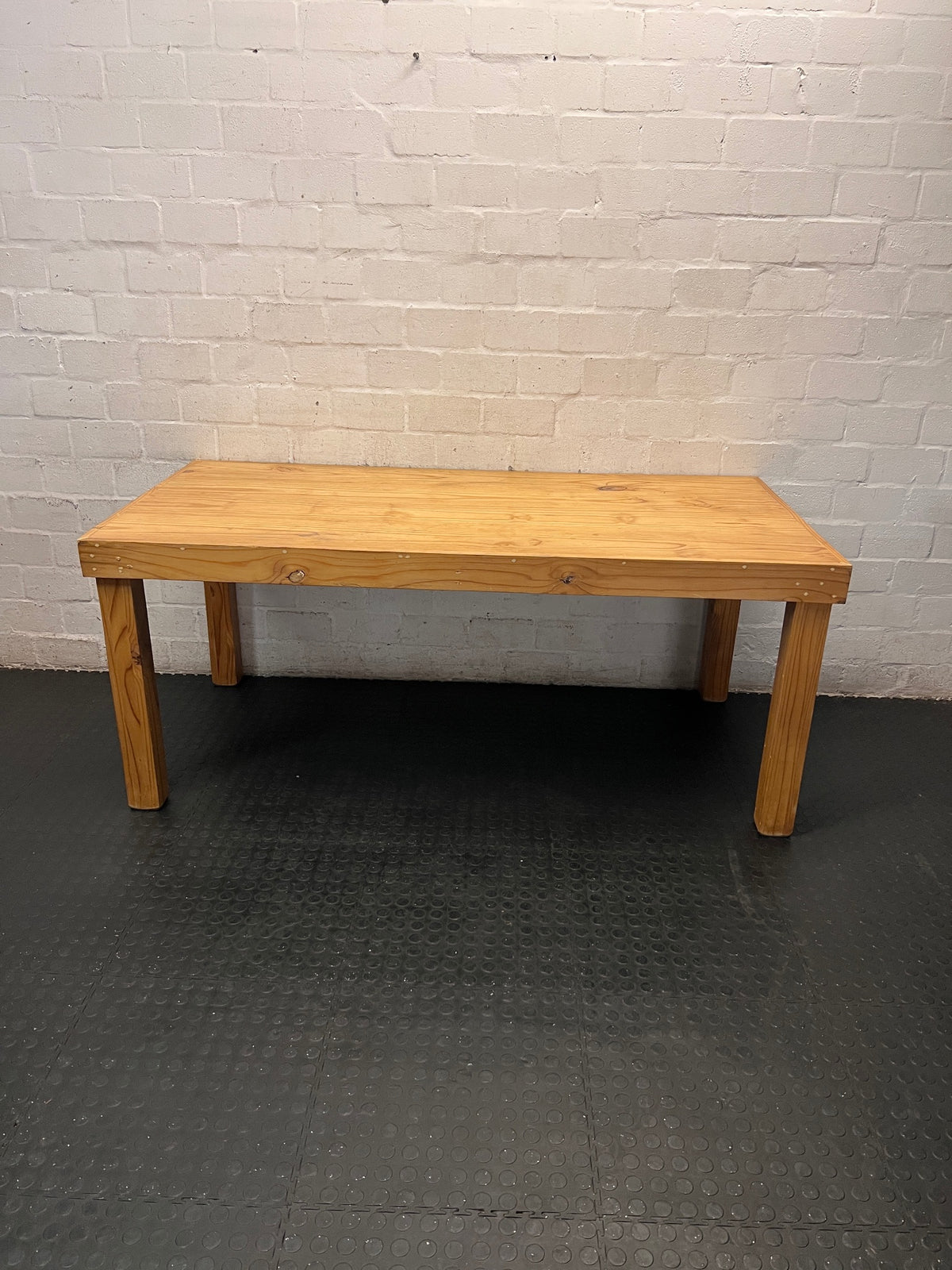 Rustic Oak-Tone Wooden Dining and Work Table — Unfinished Wood with Paint Splatter and Water Rings – main front view