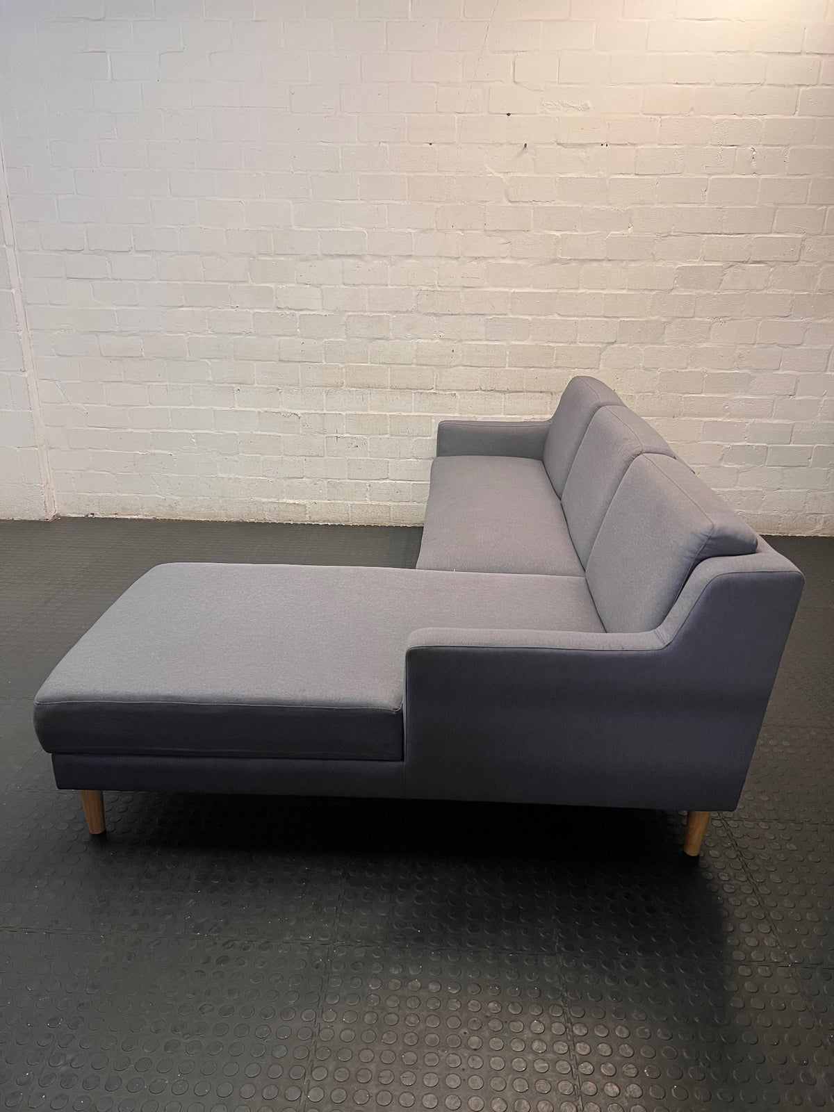 Grey L-Shaped Sectional Couch with Tapered Wood Legs — Cut at Base and Missing Attachment Bracket – back view