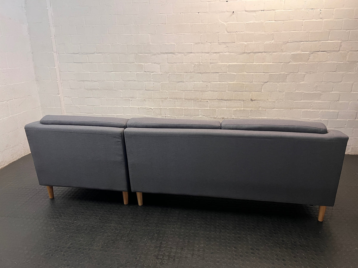 Grey L-Shaped Sectional Couch with Tapered Wood Legs — Cut at Base and Missing Attachment Bracket – condition detail