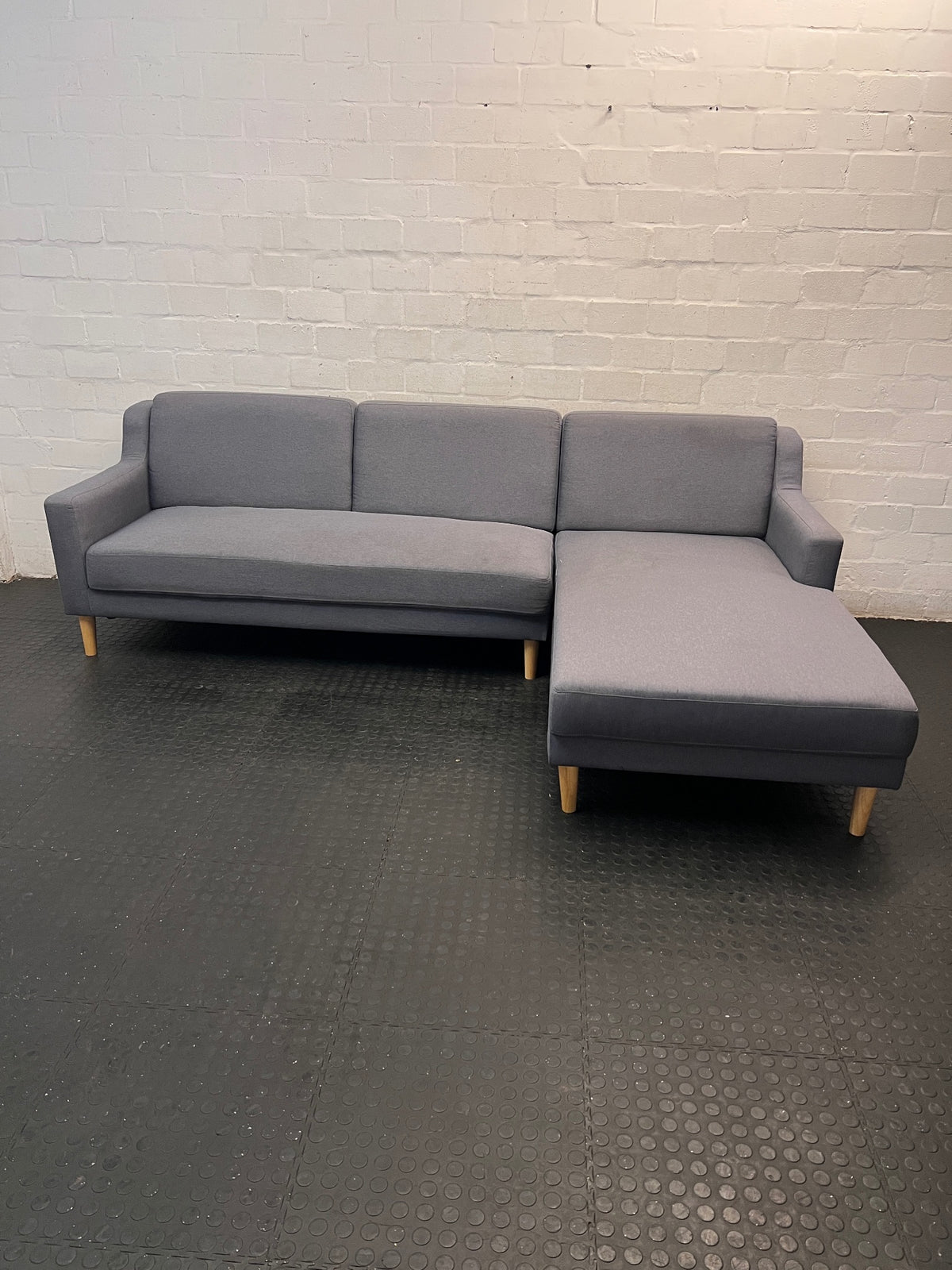 Grey L-Shaped Sectional Couch with Tapered Wood Legs — Cut at Base and Missing Attachment Bracket – main front view