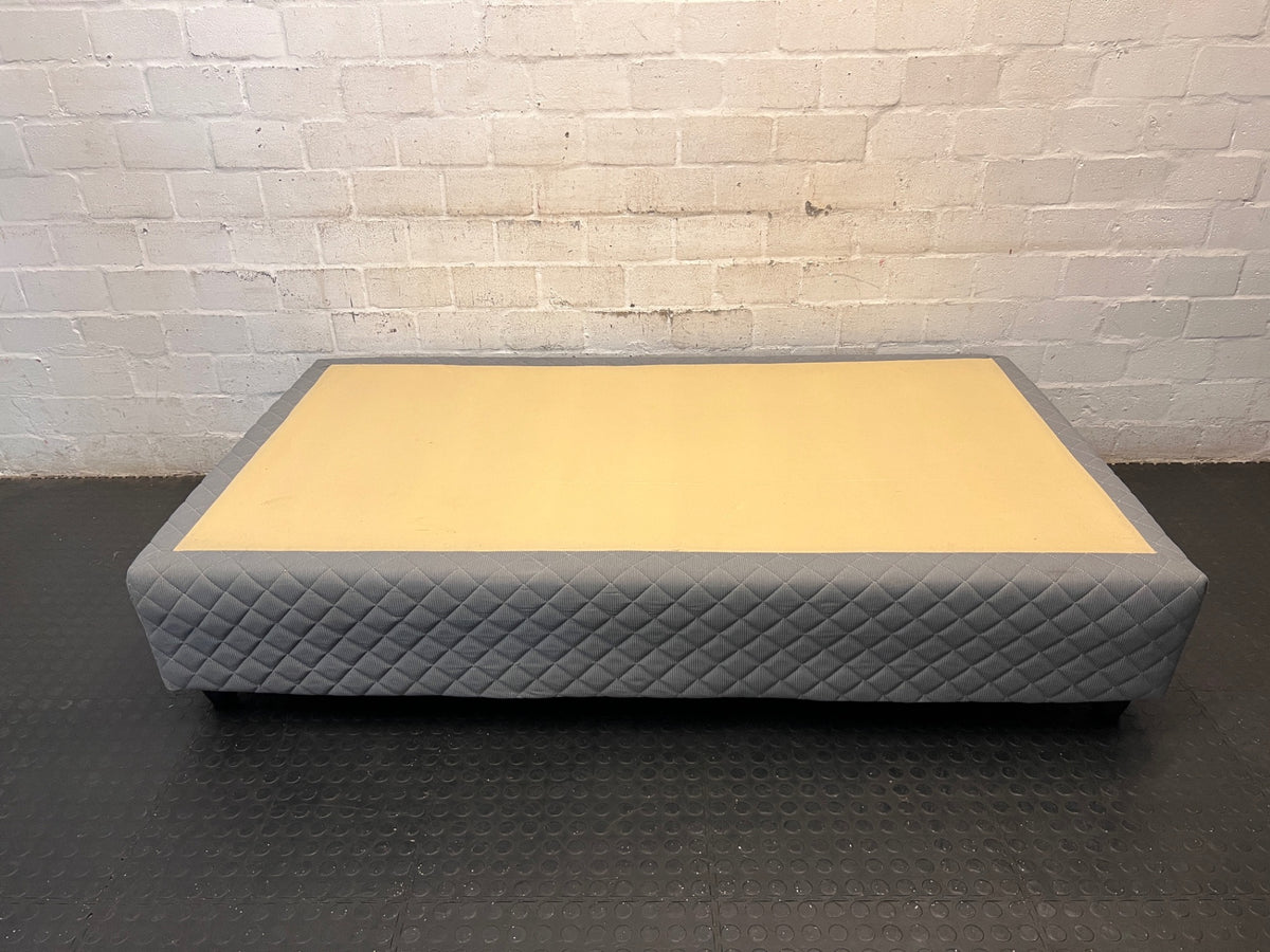 Quilted Grey Upholstered Single Bed Base — Loose Bottom Ring and Well-Used Condition – back view