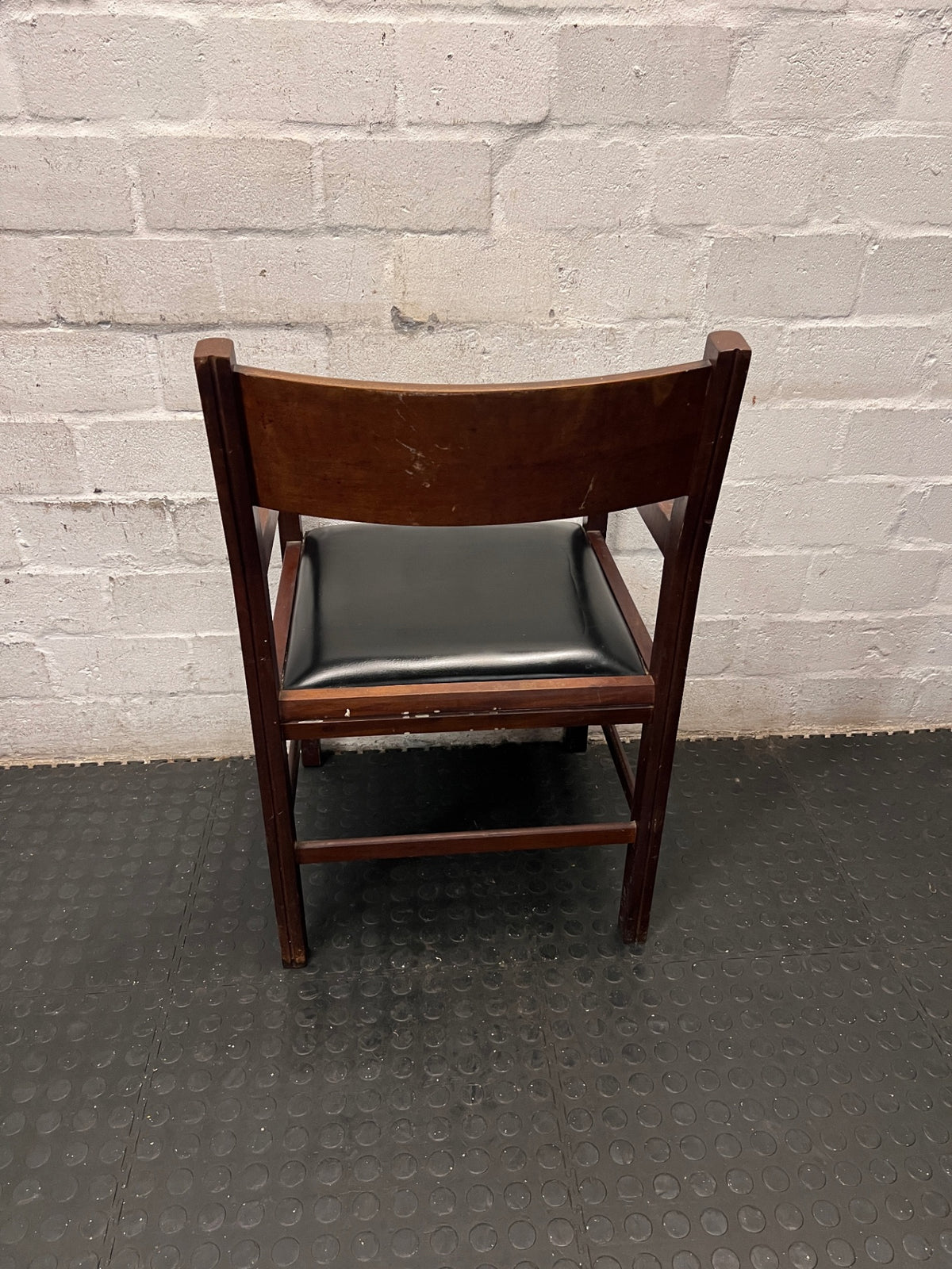 Wooden Armchair with Black Padded Seat – back view