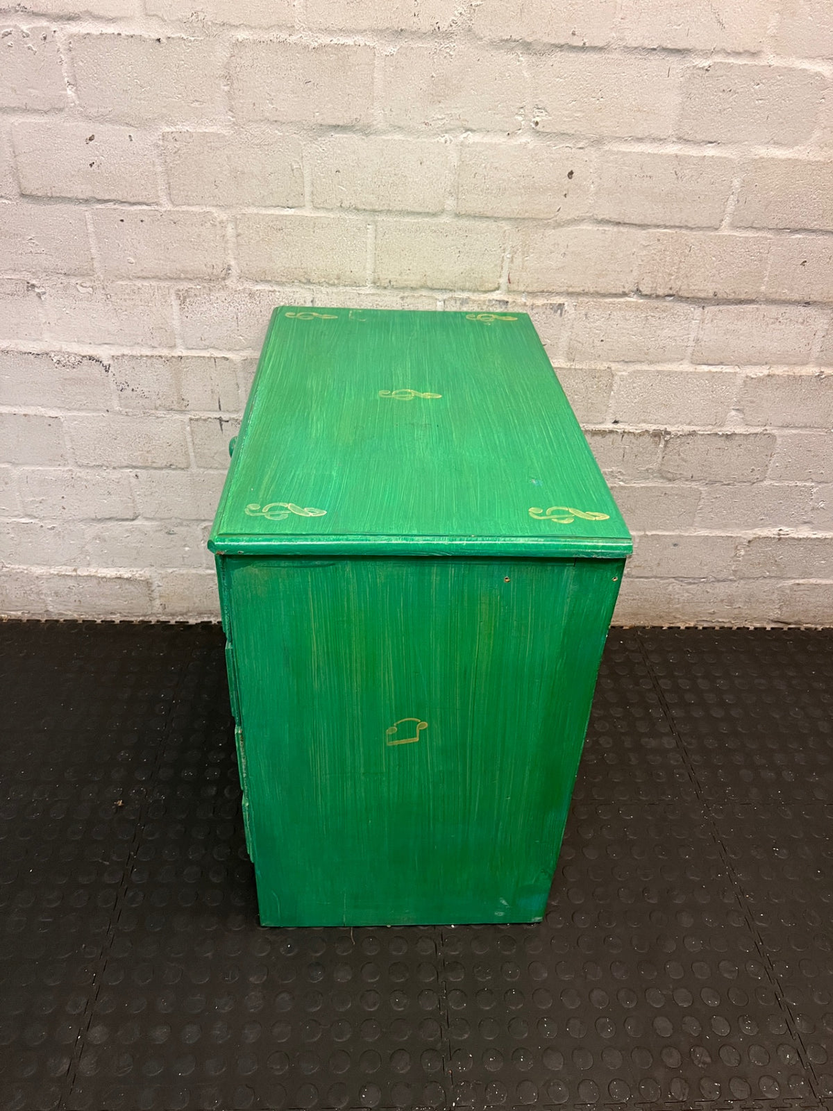 Green Four-Drawer Chest with Musical Note Motifs — Well Used with Aged Painted Finish – condition detail