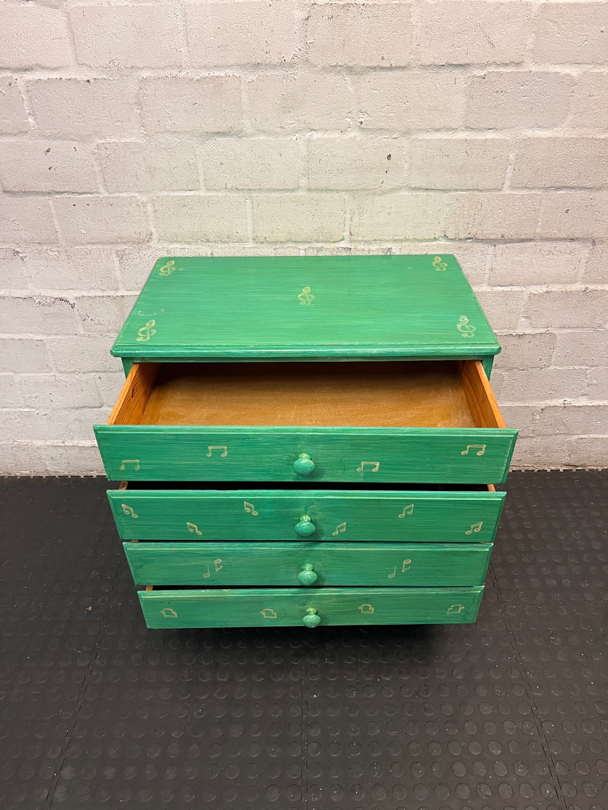Green Four-Drawer Chest with Musical Note Motifs — Well Used with Aged Painted Finish – side view
