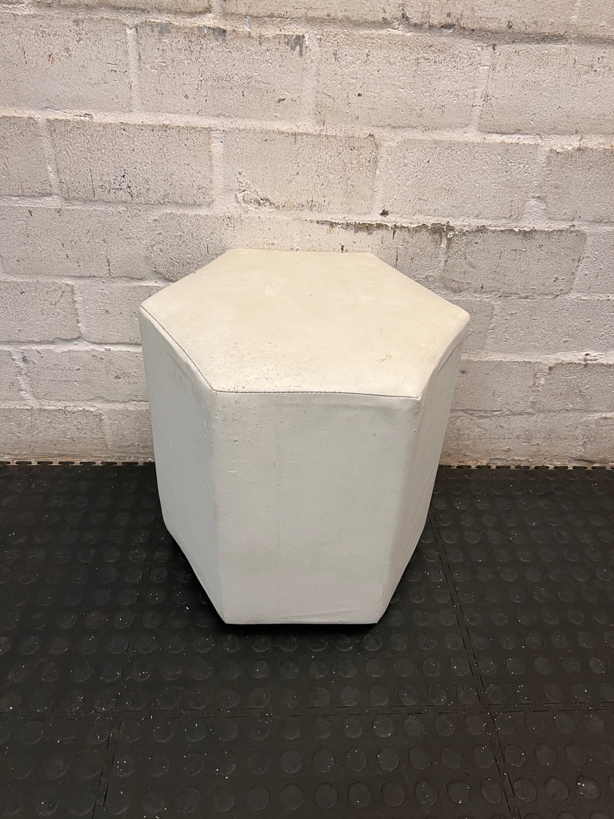 White Hexagonal Upholstered Ottoman — Aged Upholstery with Visible Wear – back view