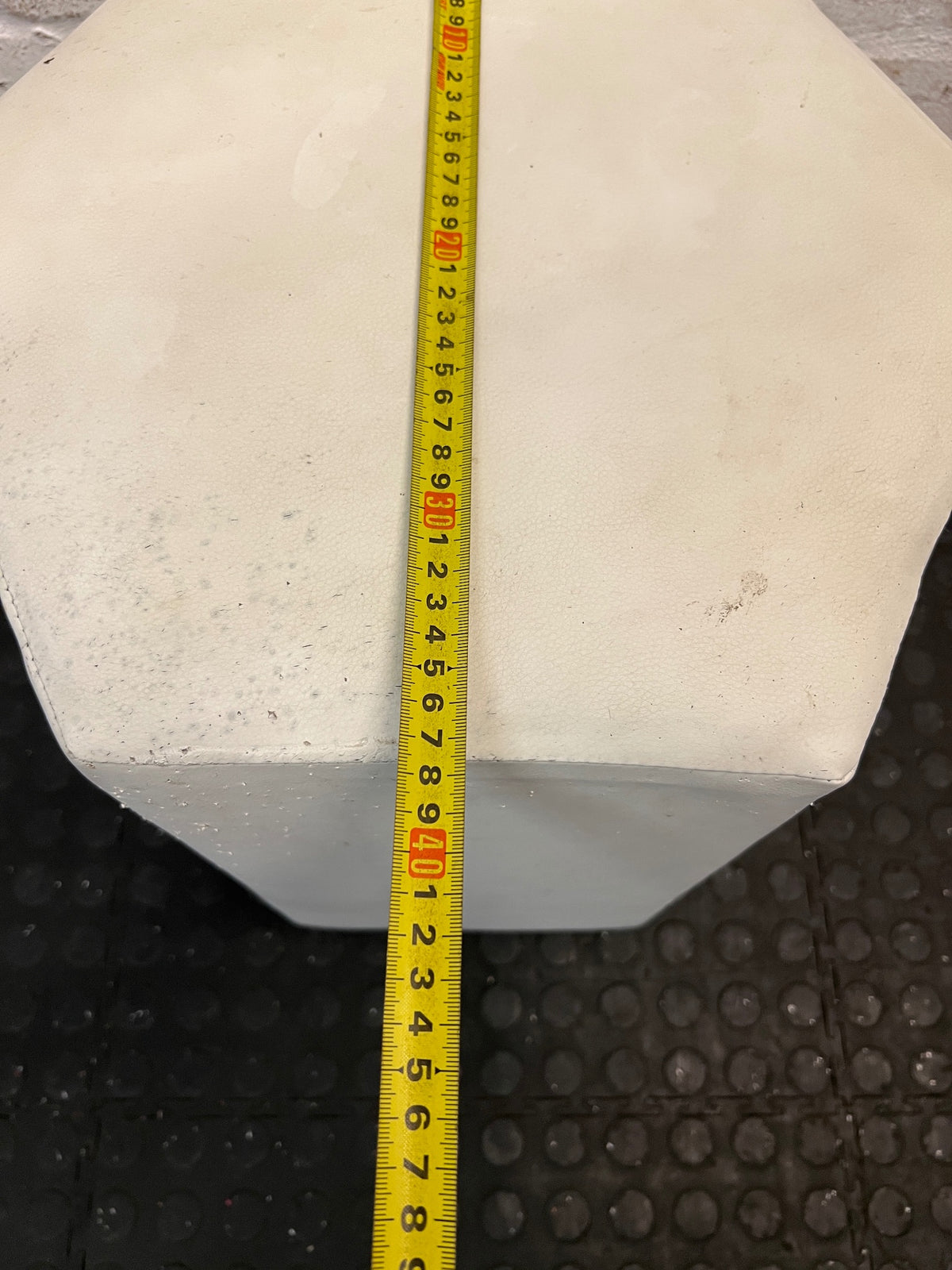 White Hexagonal Upholstered Ottoman — Aged Upholstery with Visible Wear – width measurement