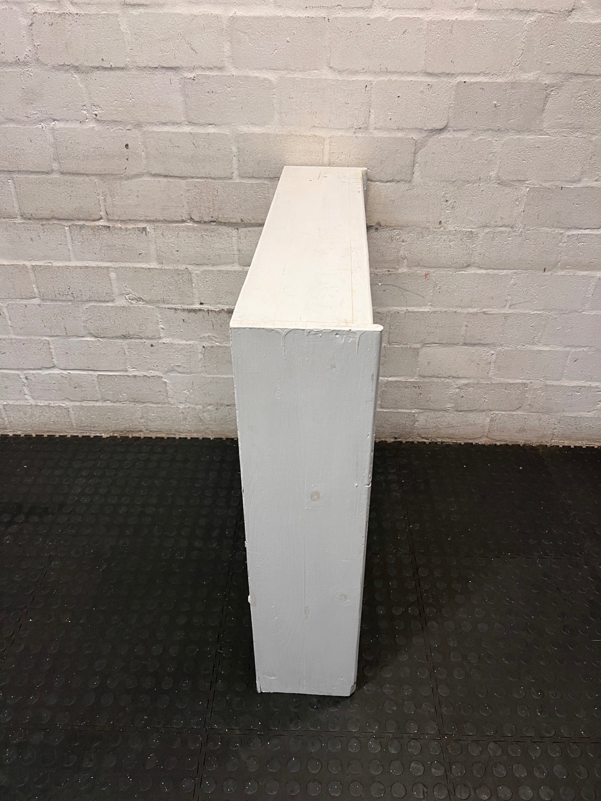 White Wooden Low Bookshelf — Well Used with Visible Surface Wear – back view