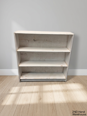 White Wooden Low Bookshelf — Well Used with Visible Surface Wear – styled product image