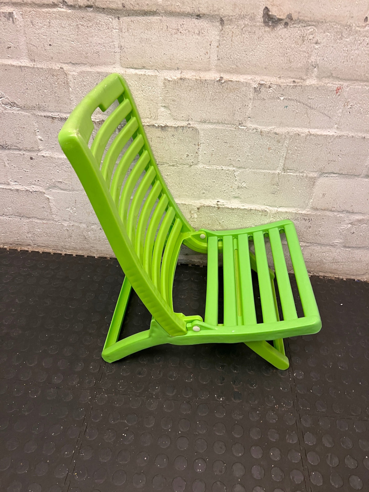 Lime Green Plastic Folding Outdoor Chair — Faded Finish on Chairs – back view