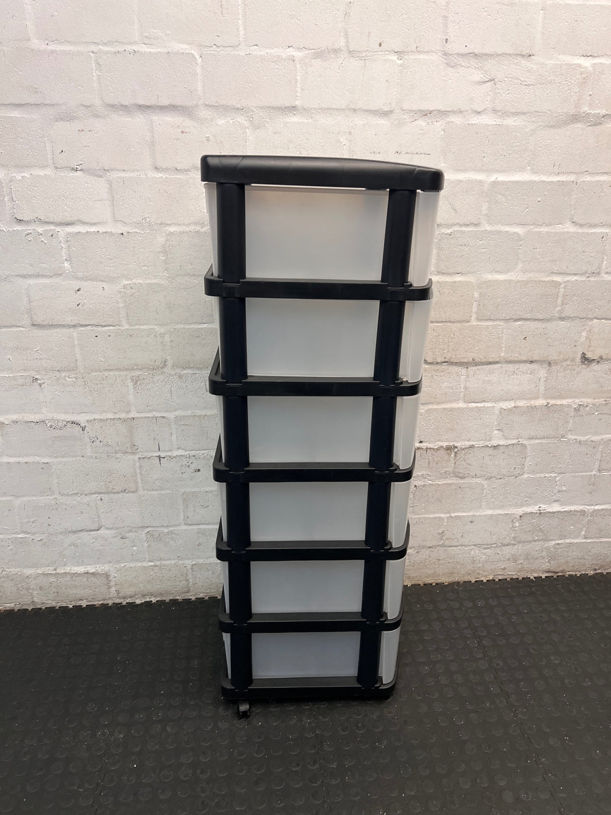 6-Tier Black and Translucent Plastic Storage Tower — Used; Fair Condition – back view