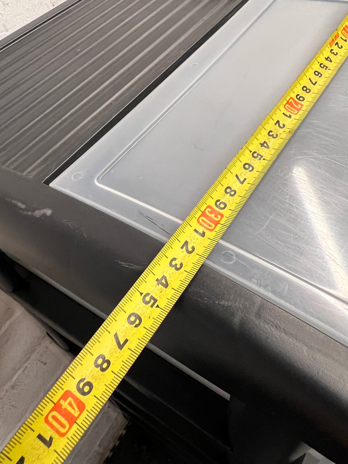6-Tier Black and Translucent Plastic Storage Tower — Used; Fair Condition – depth measurement