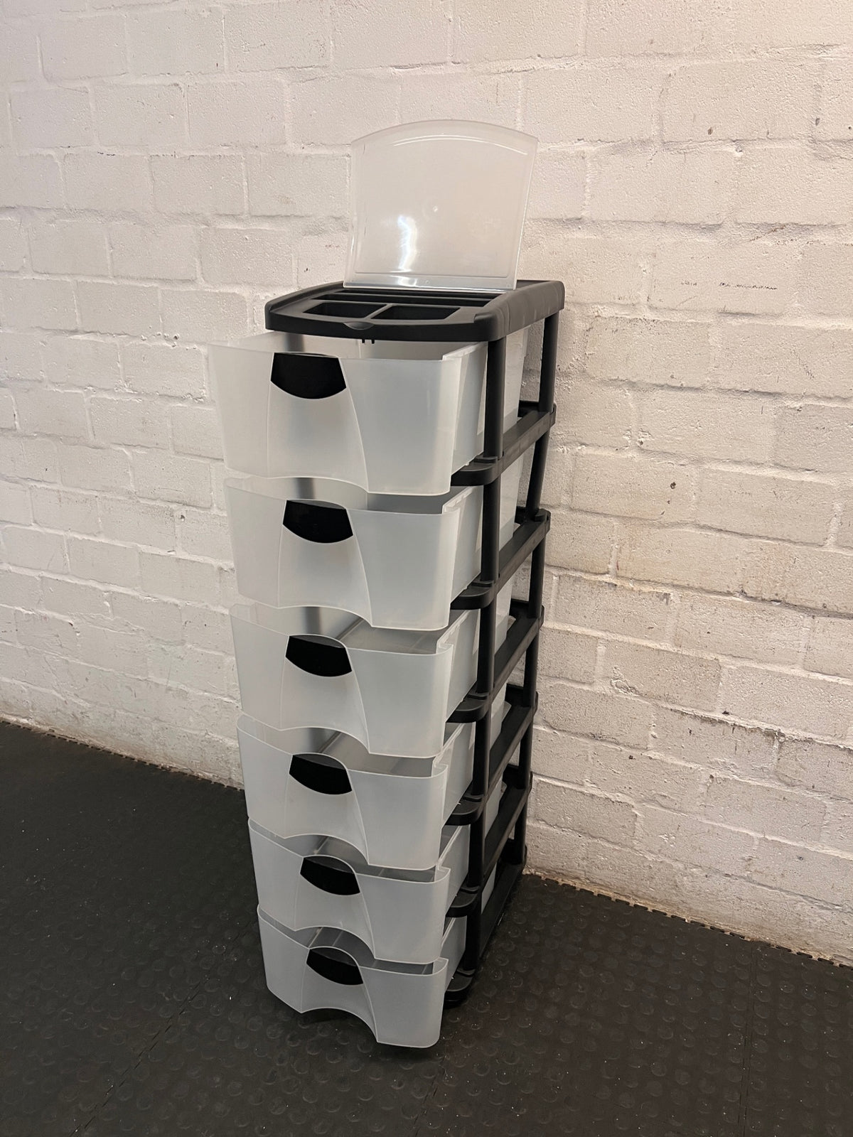 6-Tier Black and Translucent Plastic Storage Tower — Used; Fair Condition – side view