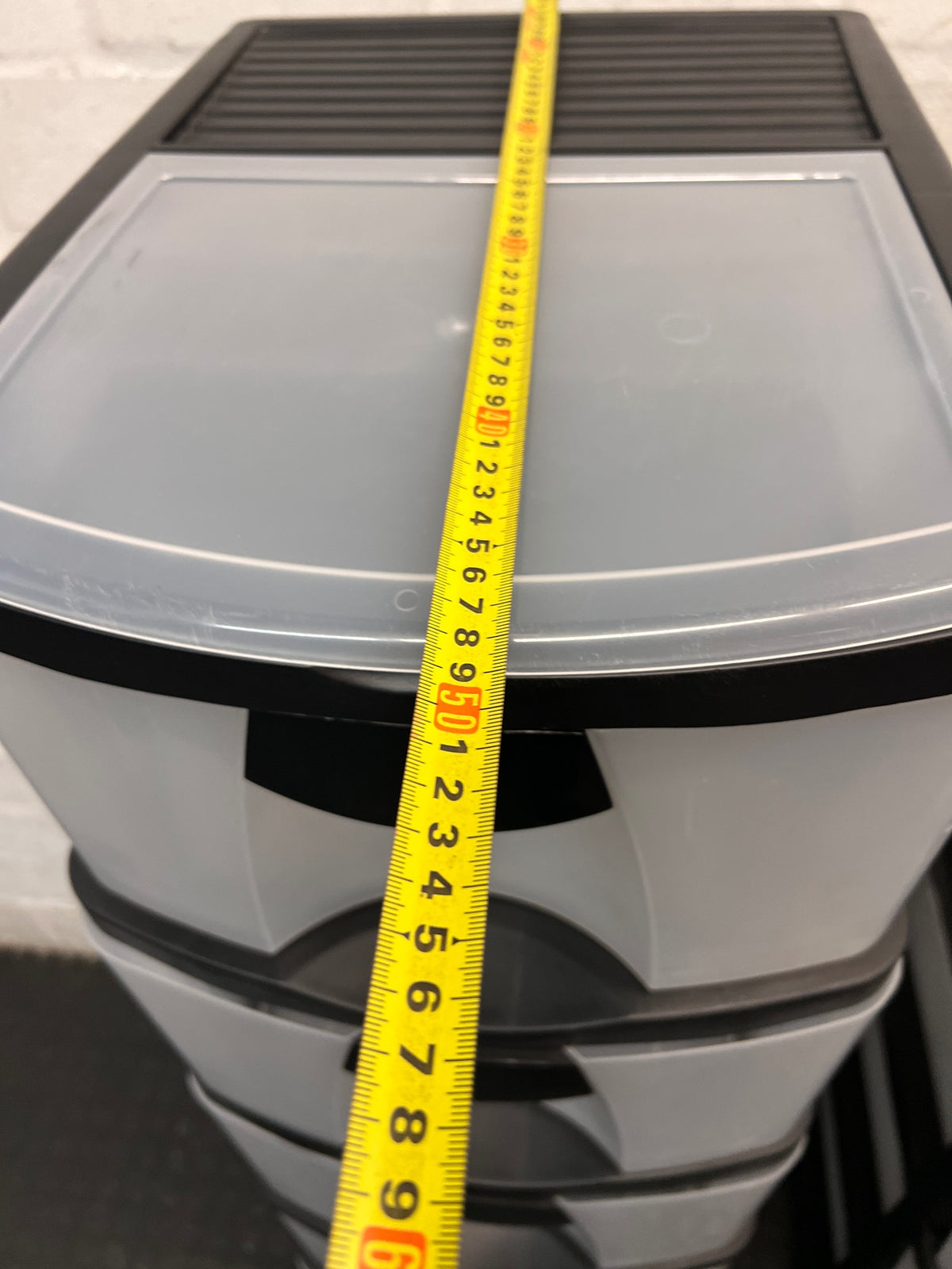6-Tier Black and Translucent Plastic Storage Tower — Used; Fair Condition – width measurement
