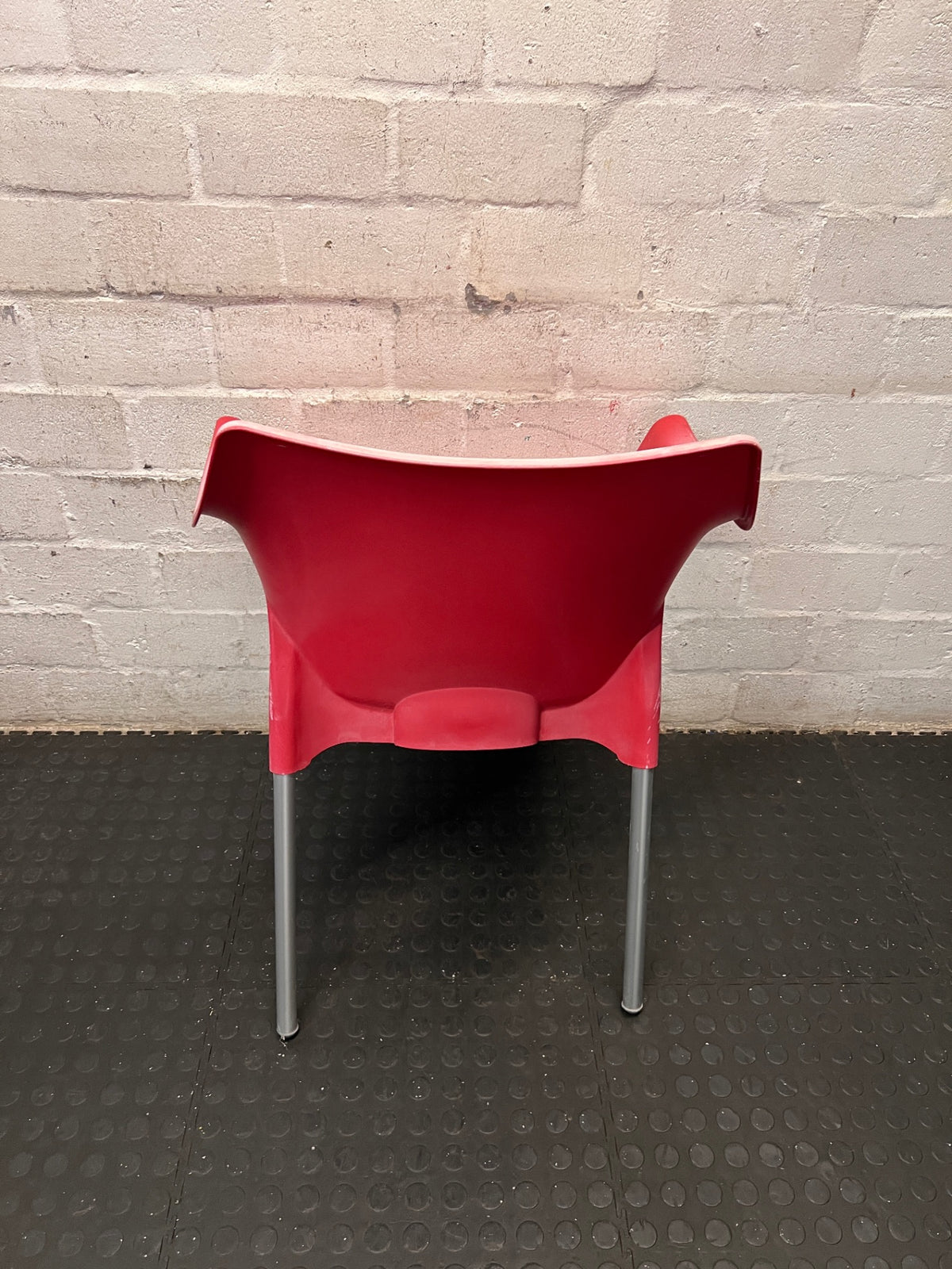 Modern Red Moulded Plastic Chair with Metal Legs — Faded Red Chairs in Fair Condition – back view