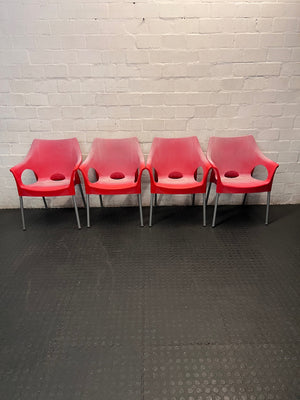 Modern Red Moulded Plastic Chair with Metal Legs — Faded Red Chairs in Fair Condition – side view