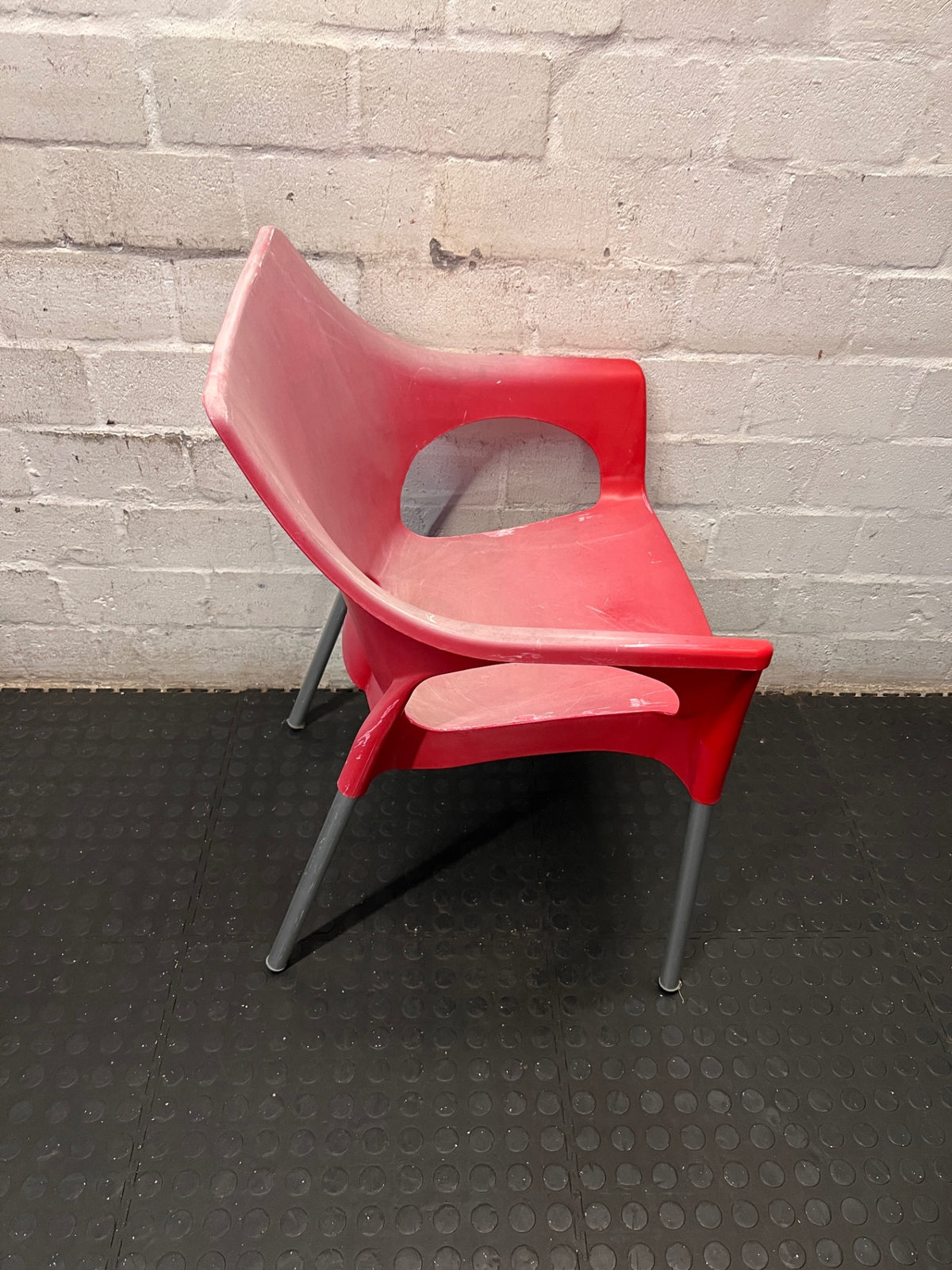 Modern Red Moulded Plastic Chair with Metal Legs — Faded Red Chairs in Fair Condition – top view