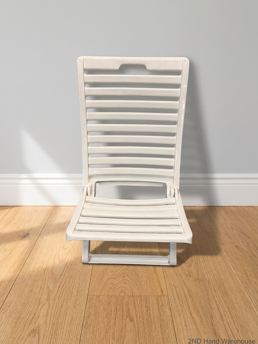 White Slatted Plastic Folding Chair – styled product image