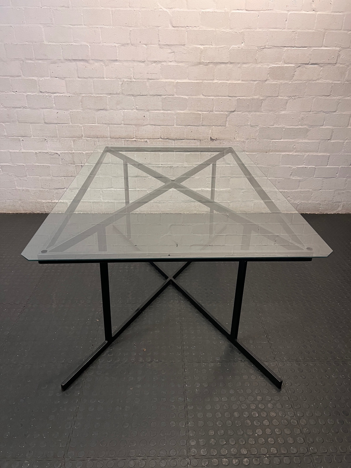 Black Metal and Glass Dining Table with X-Base — Rust Markings on Metal Base – top view