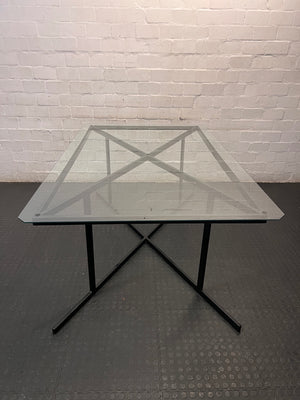 Black Metal and Glass Dining Table with X-Base — Rust Markings on Metal Base – top view