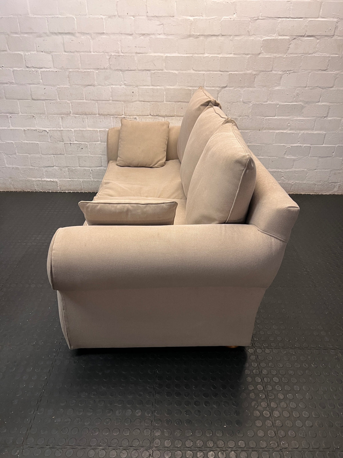 Beige Upholstered 2 Seater Couch with Rolled Arms — Very Good Condition – side view