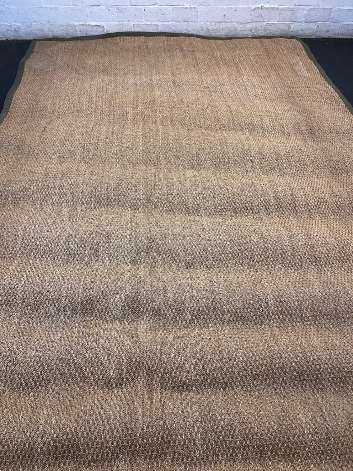 Large Woven Brown Area Rug with Fabric Border — Fair Condition with Visible Wear – condition detail