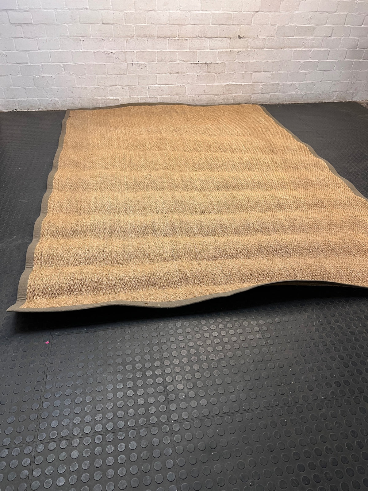 Large Woven Brown Area Rug with Fabric Border — Fair Condition with Visible Wear – main front view