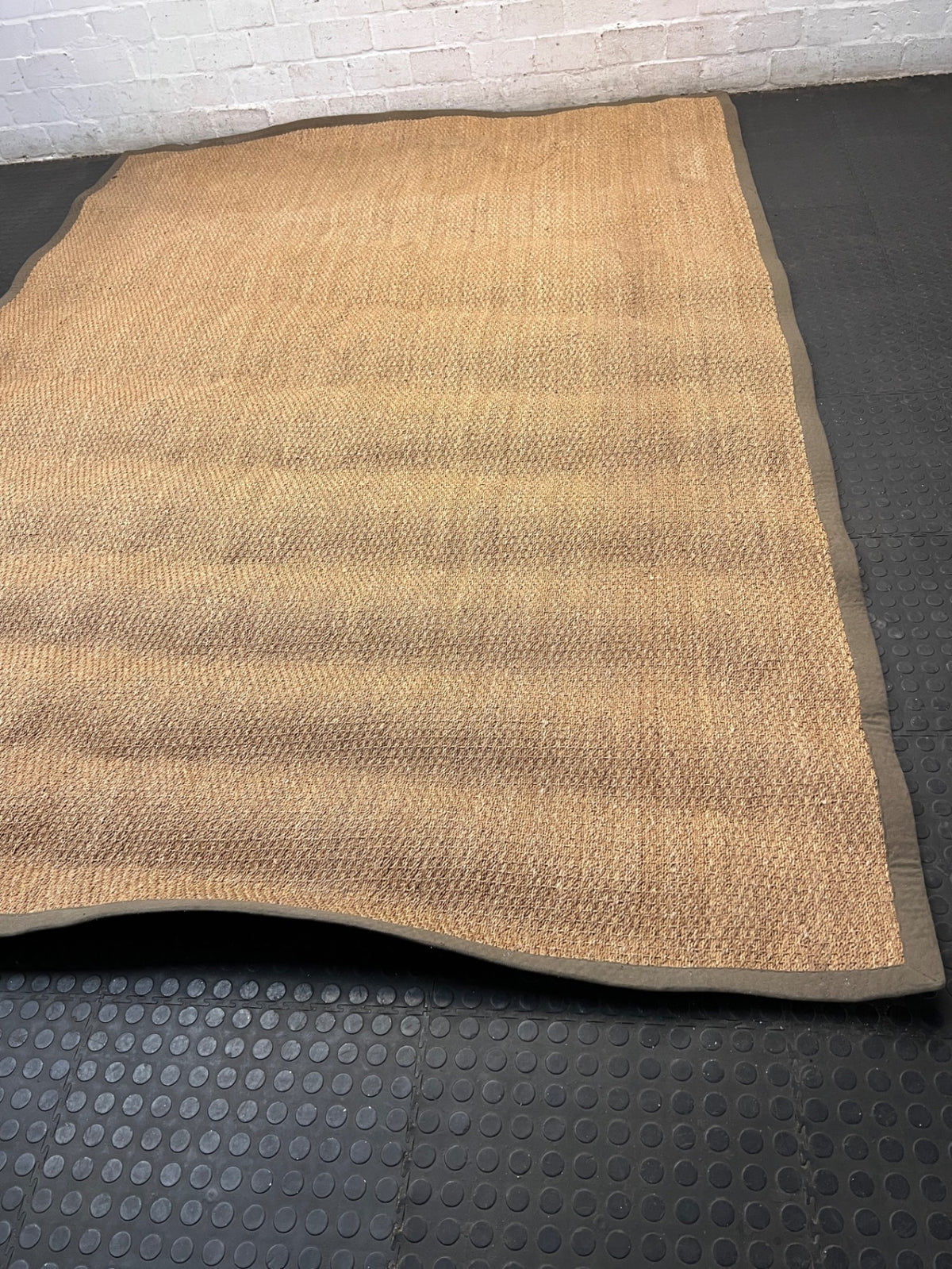 Large Woven Brown Area Rug with Fabric Border — Fair Condition with Visible Wear – width measurement