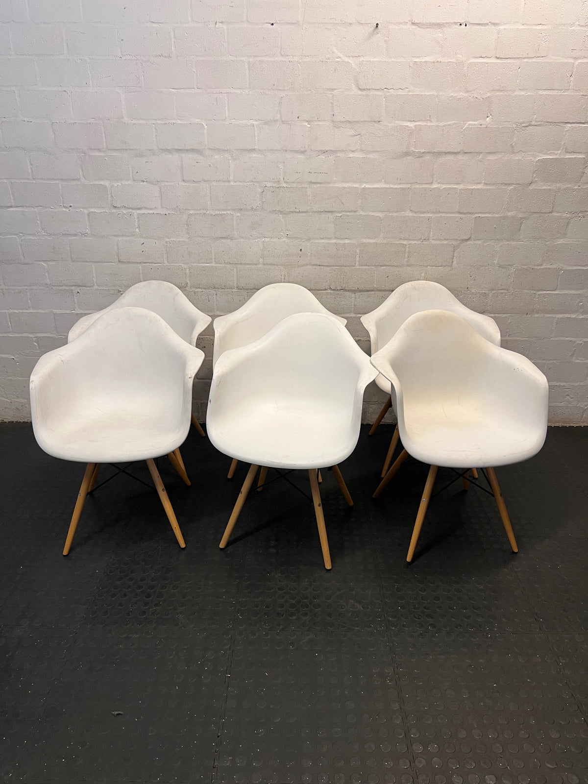 Moulded White Dining Chair with Tapered Wooden Legs — Visible Wear and Surface Marks – side view