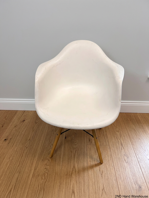 Moulded White Dining Chair with Tapered Wooden Legs — Visible Wear and Surface Marks – styled product image