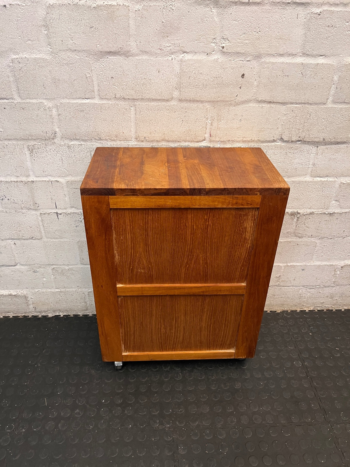 Slim Timber Bedside Pedestal on Castors — Fair Condition With Visible Wear – back view