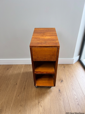 Slim Timber Bedside Pedestal on Castors — Fair Condition With Visible Wear – styled product image