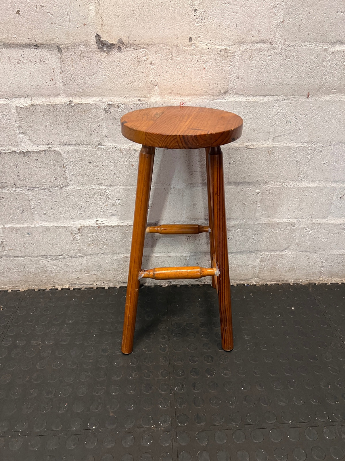 Classic Brown Wooden Bar Stool with Round Seat — Worn Condition with Structural Wear – condition detail