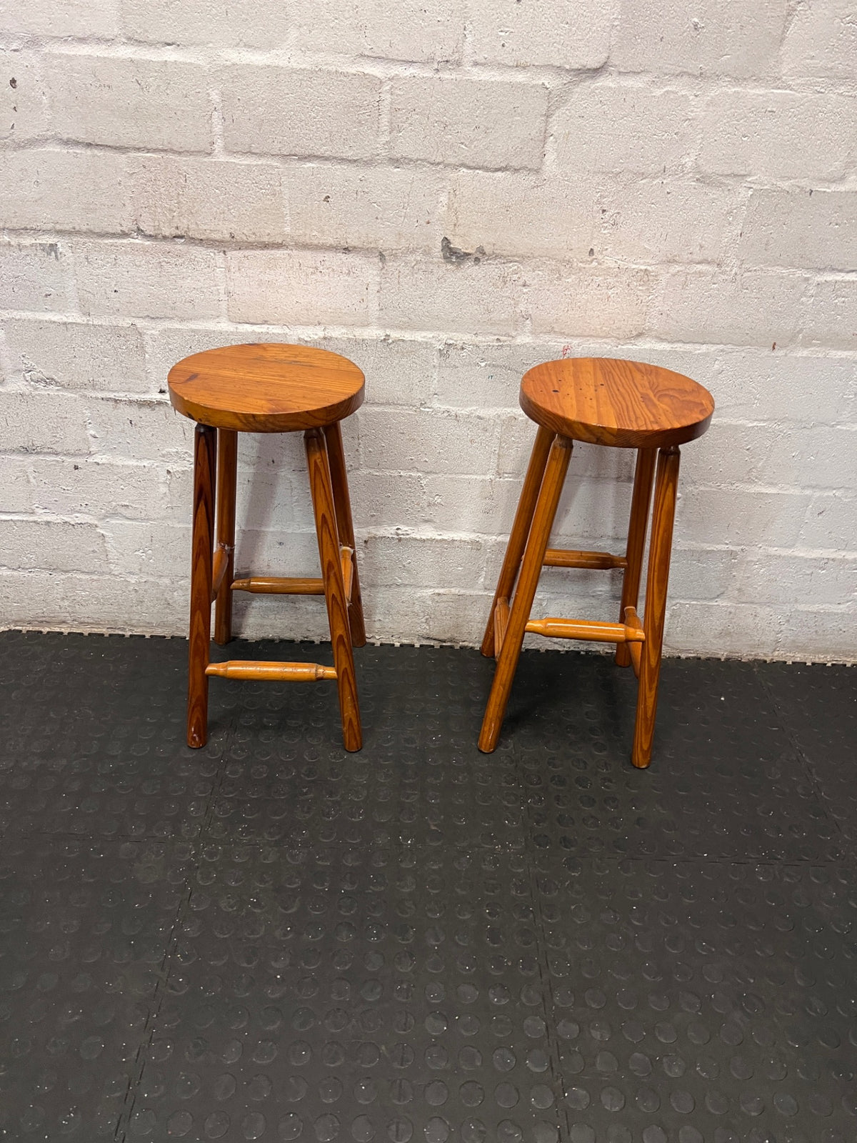 Classic Brown Wooden Bar Stool with Round Seat — Worn Condition with Structural Wear – side view