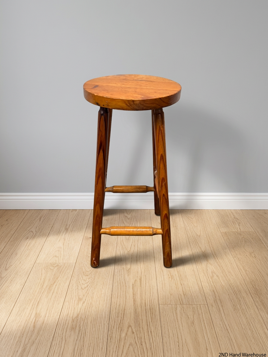 Classic Brown Wooden Bar Stool with Round Seat — Worn Condition with Structural Wear – styled product image