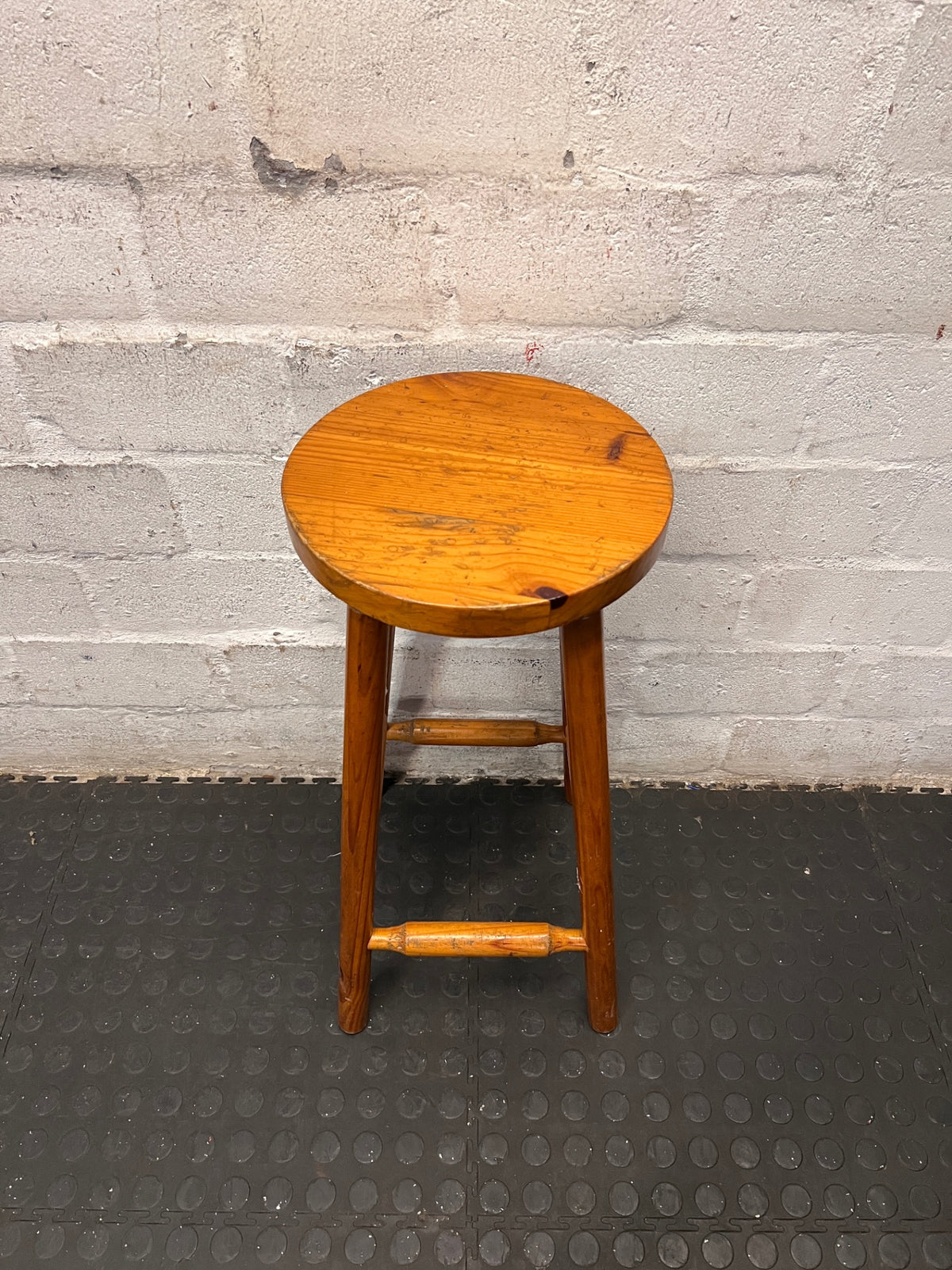 Classic Brown Wooden Bar Stool with Round Seat — Worn Condition with Structural Wear – top view