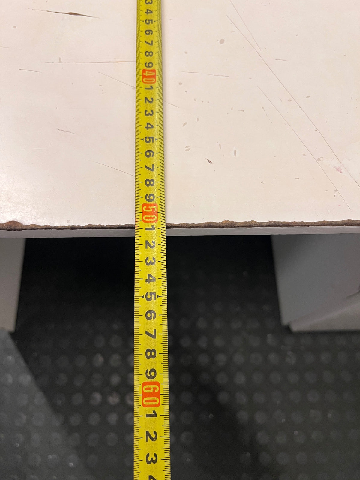 Compact White Office Desk with Right-Hand Pedestal — Visible Wear and Structural Damage – depth measurement