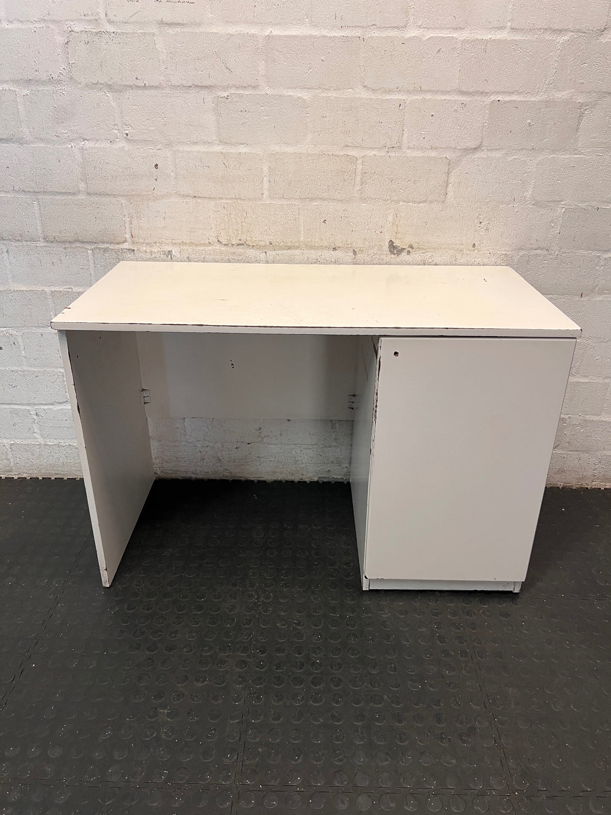 Compact White Office Desk with Right-Hand Pedestal — Visible Wear and Structural Damage – main front view