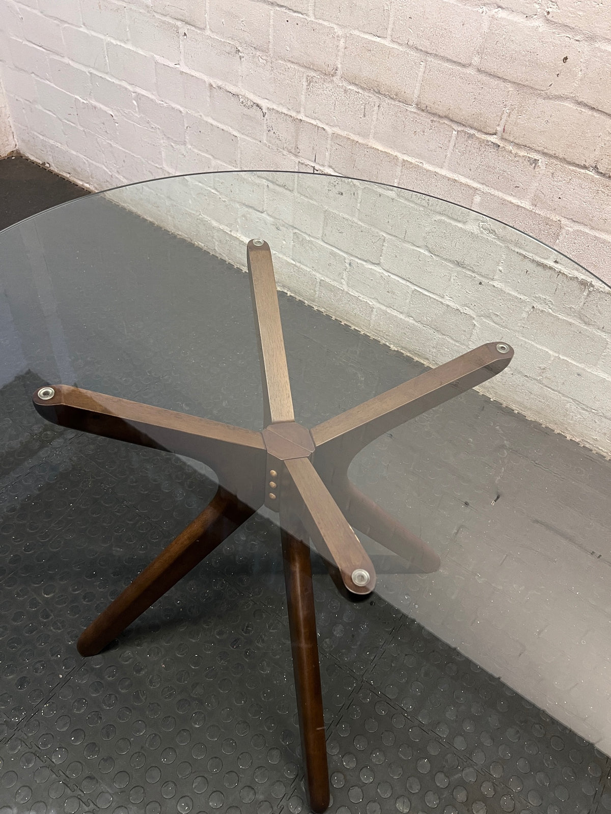 @home Round Glass Top Dining Table with Wood Base — Minor Scratches on Leg and Missing Bolt Cover – back view