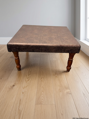 Brown Upholstered Square Coffee Table with Turned Legs — Well Used Condition – styled product image