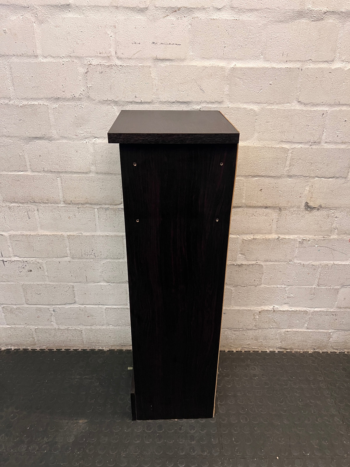 Black Slim Display Cabinet with Glass Door and Drawer — Well Used with Visible Wear – back view
