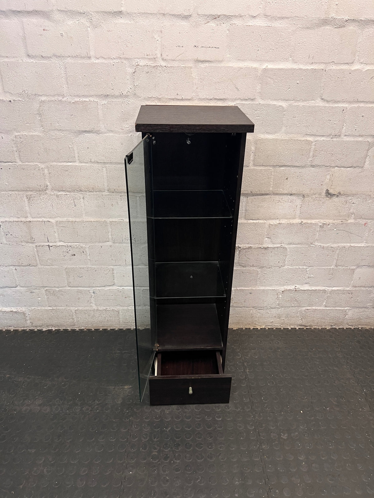 Black Slim Display Cabinet with Glass Door and Drawer — Well Used with Visible Wear – condition detail