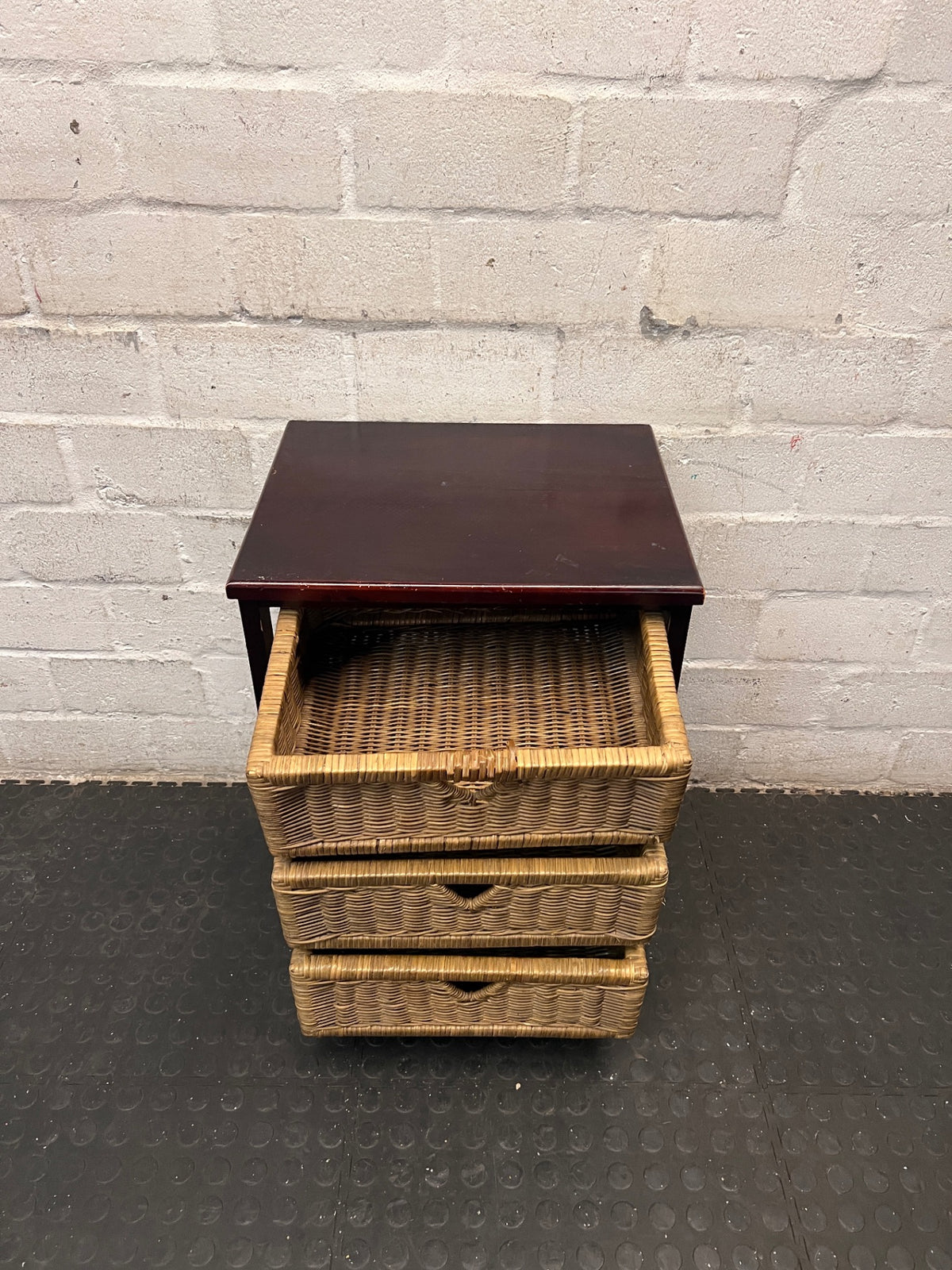 Dark Wood Bedside Table with Woven Wicker Drawers — Well Used with Visible Surface Wear – condition detail