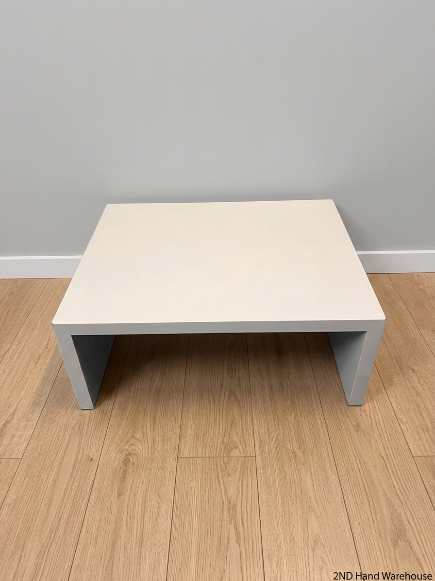 Minimalist White Rectangular Coffee Table — Wear and Minor Scratches on Side – styled product image