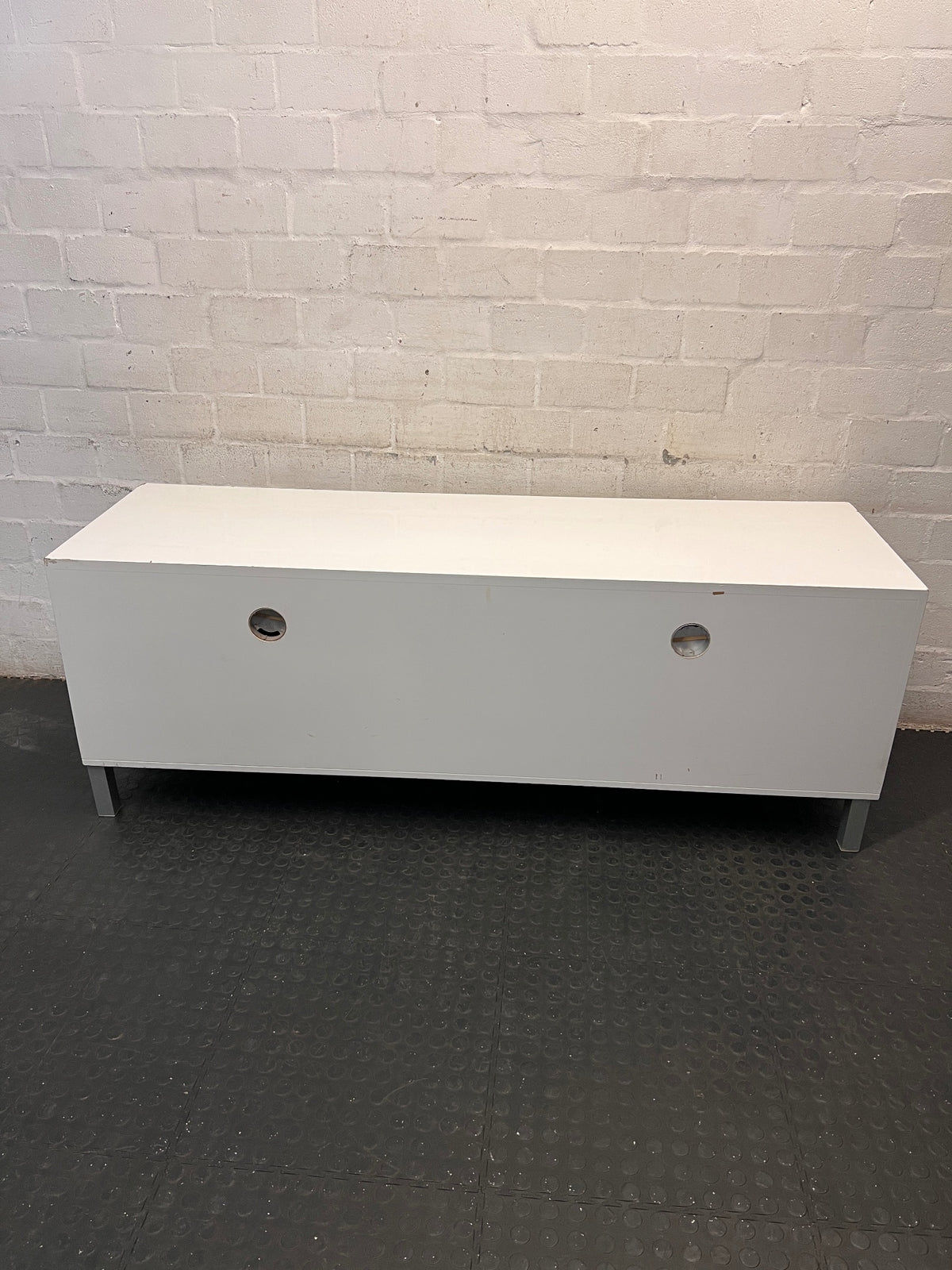 White Four-Drawer TV Unit with Metal Handles — Minor Bump Damage on Front Corners – back view