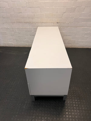 White Four-Drawer TV Unit with Metal Handles — Minor Bump Damage on Front Corners – condition detail