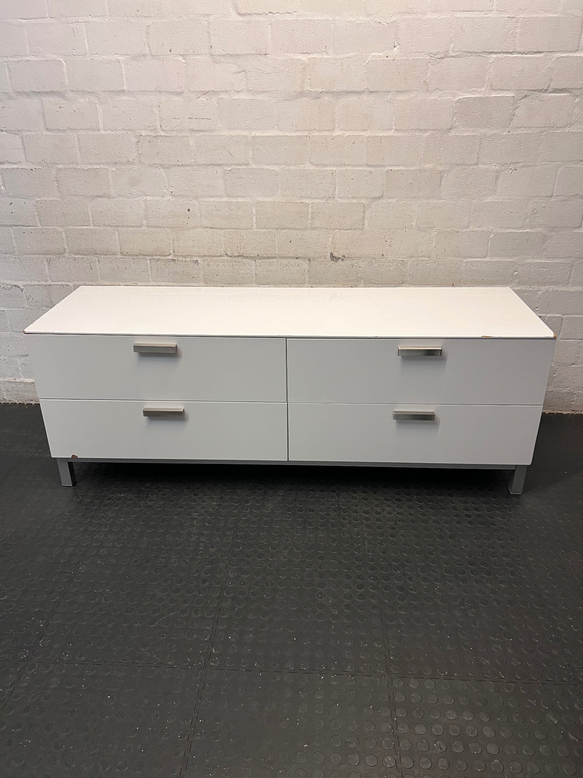 White Four-Drawer TV Unit with Metal Handles — Minor Bump Damage on Front Corners – main front view