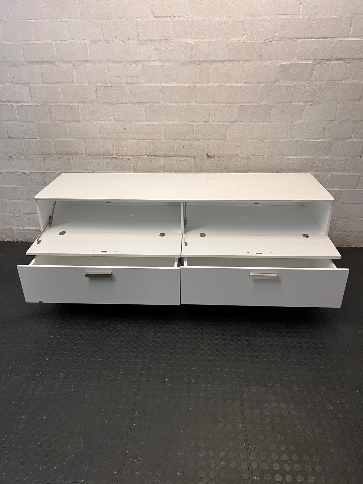 White Four-Drawer TV Unit with Metal Handles — Minor Bump Damage on Front Corners – side view